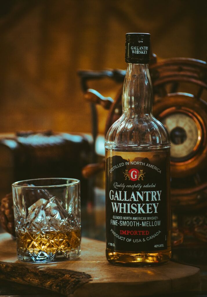 gallantry whiskey bottle beside glass